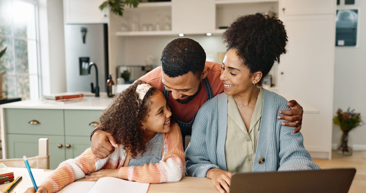 Parent working remotely from home with child nearby