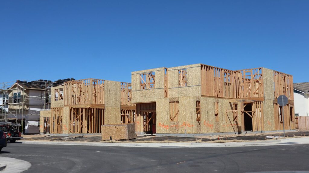 New homes under construction in a growing subdivision
